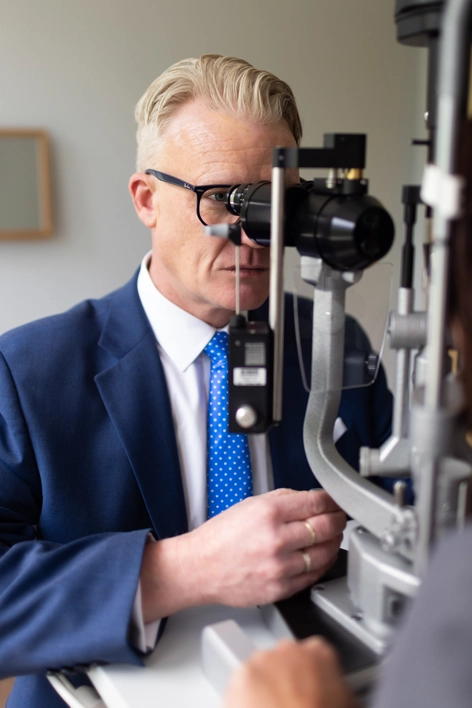 Dr. Duffy examining a patient at the slit lamp